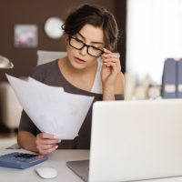 Young woman hard working at home